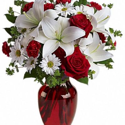 <div class="m-pdp-tabs-description">
<div id="mark-1" class="m-pdp-tabs-marketing-description">

The spirit of love and romance is beautifully captured in this enchanting bouquet. It's the perfect gift for anyone you love.

</div>
</div>
Red roses and carnations are exquisitely arranged with white asiatic lilies and chrysanthemums in a ruby red glass vase. It's lovely.