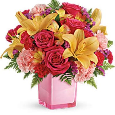 <div id="mark-3" class="m-pdp-tabs-marketing-description">Pop go the petals! This festive, fun-loving mix of flowers is a cheerful gift for any occasion. Hand-delivered in a glass cube, these pink roses and bright peach lilies are guaranteed to please!</div>
<div id="desc-3">
<ul>
 	<li>This fresh, fun mix of pink roses, peach asiatic lilies, peach alstroemeria, pink carnations and pink miniature carnations is accented with raspberry sinuata statice and leatherleaf fern.</li>
</ul>
</div>