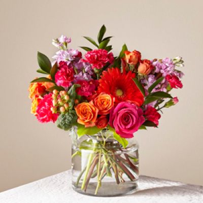 The Fiesta Bouquet is composed of a lively mix, fit to celebrate any and every moment. With a combination of vibrant flowers, this florist-designed arrangement brings a pop of color and a burst of excitement as soon as it arrives.