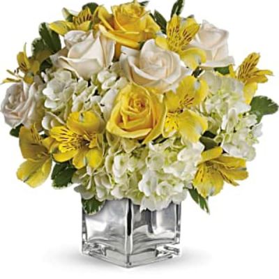 <div id="mark-3" class="m-pdp-tabs-marketing-description">Even if she's already in a great mood, this cheerfully charming bouquet will boost her spirits to the sky. Yellow roses, crème roses and other favorites in a sleek silver cube vase - irresistible!</div>
<div id="desc-3">
<ul>
 	<li>The bright bouquet includes white hydrangea, light yellow roses, crème roses and yellow alstroemeria accented with fresh greenery.</li>
 	<li>Delivered in a contemporary glass cube with a mirrored silver finish.</li>
</ul>
</div>